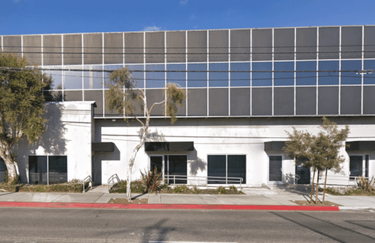 Corporate headquarters reduces energy use through LED lighting retrofit, and wireless thermostats